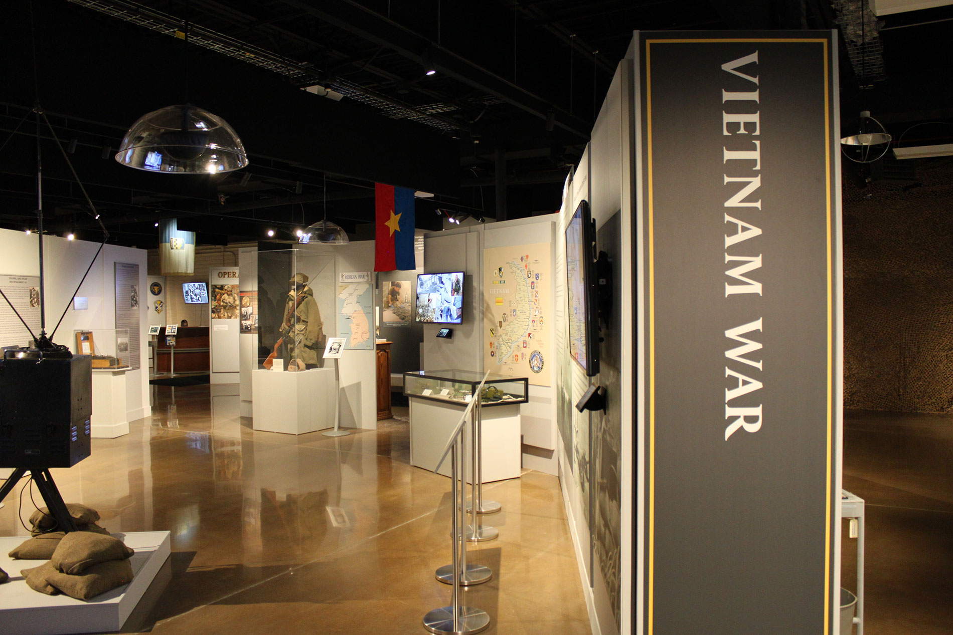 Vietnam War exhibit inside museum room with several artifacts.